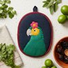 Bonito the Parrot Potholder, a handwoven cotton kitchen potholder from the Frida Garden Kitchen Collection