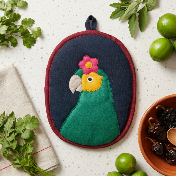 Bonito the Parrot Potholder, a handwoven cotton kitchen potholder from the Frida Garden Kitchen Collection
