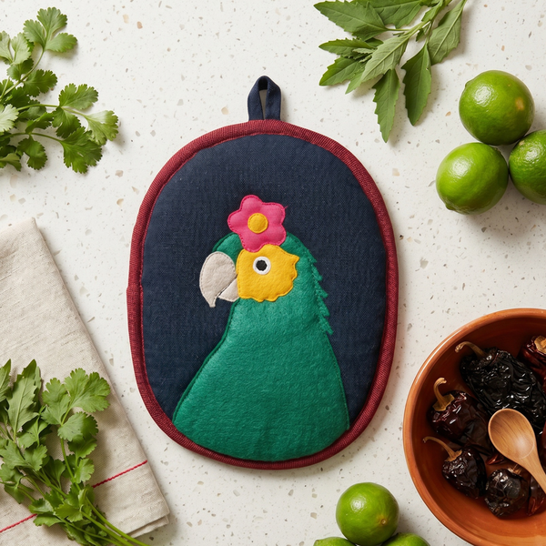 Bonito the Parrot Potholder showing the handwoven cotton front and hanging loop