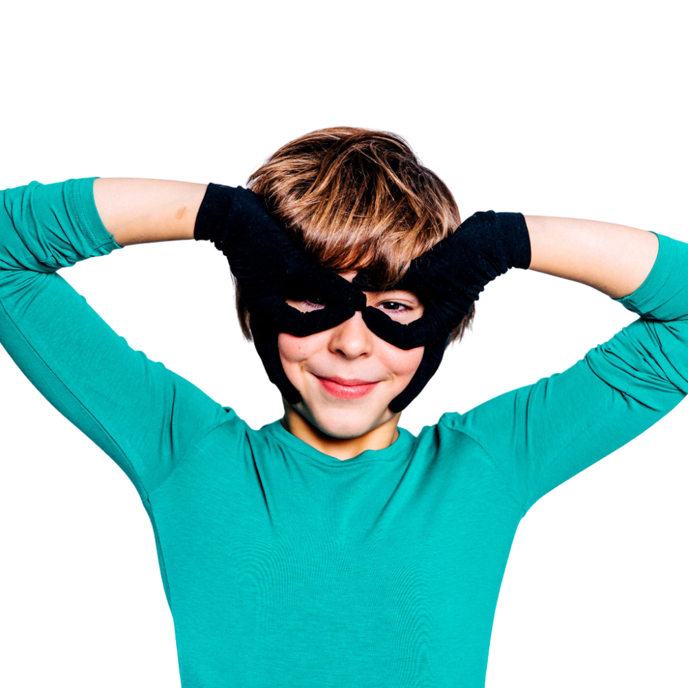 Boy wearing black Remedywear eczema gloves for kids showing snug second-skin fit on hands and wrists