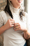 Stately Striped Recycled Brass Ring shown in a ring stack with other handcrafted brass rings