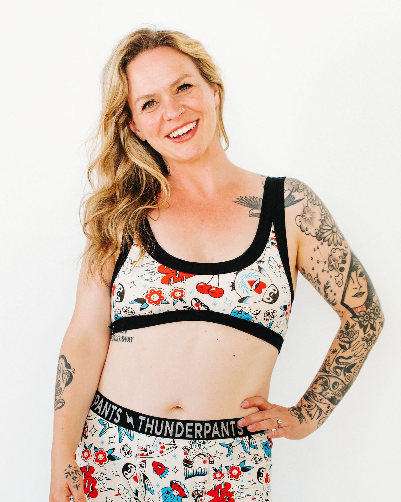 Front view of the Inked Up women's bralette featuring whimsical tattoo print artwork