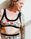 Side view of the Thunderpants Inked Up Bralette showing tattoo-inspired character print detail