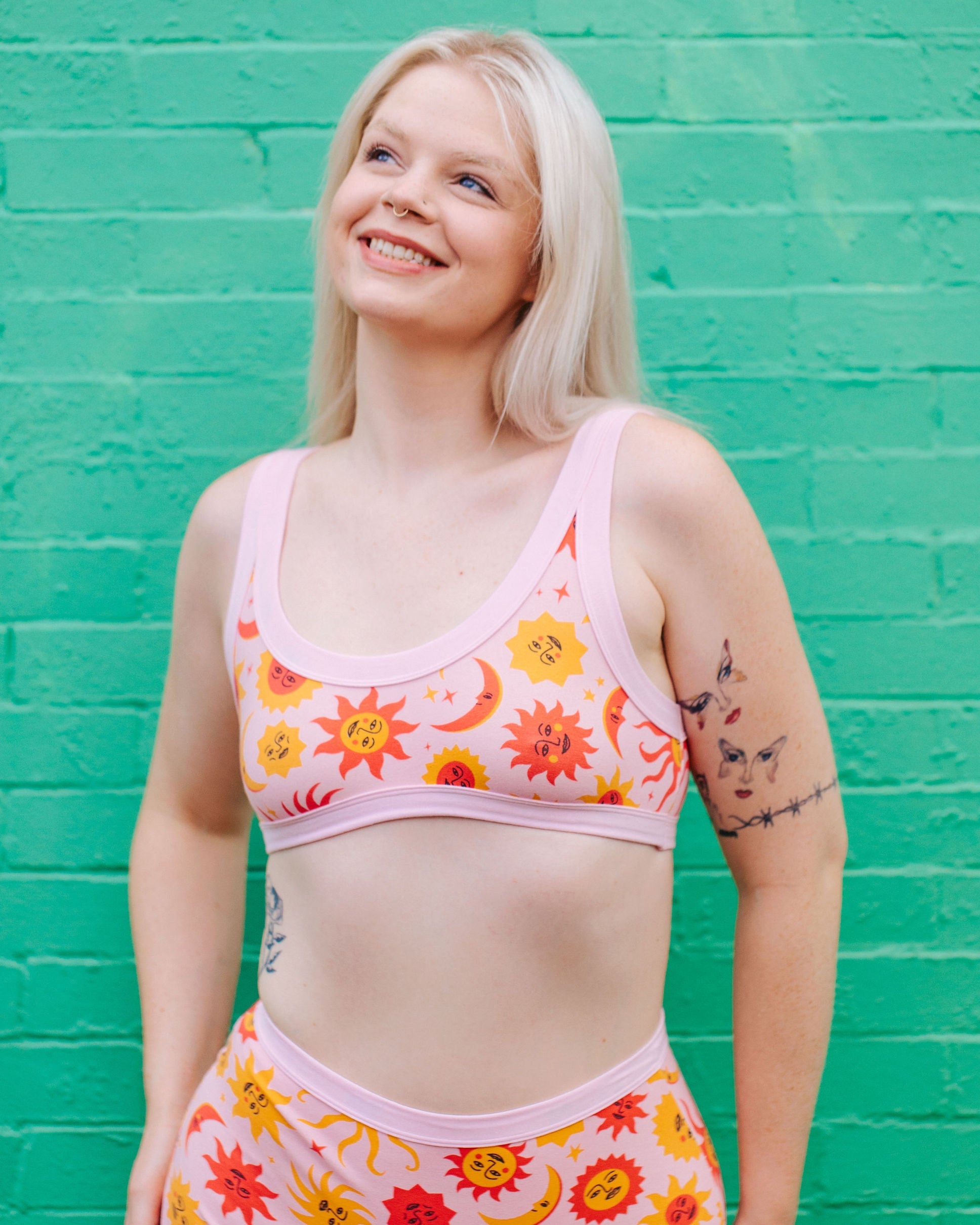 Front view of the Luna y Sol Bralette featuring vibrant 90s-inspired celestial artwork by Greta Menzies