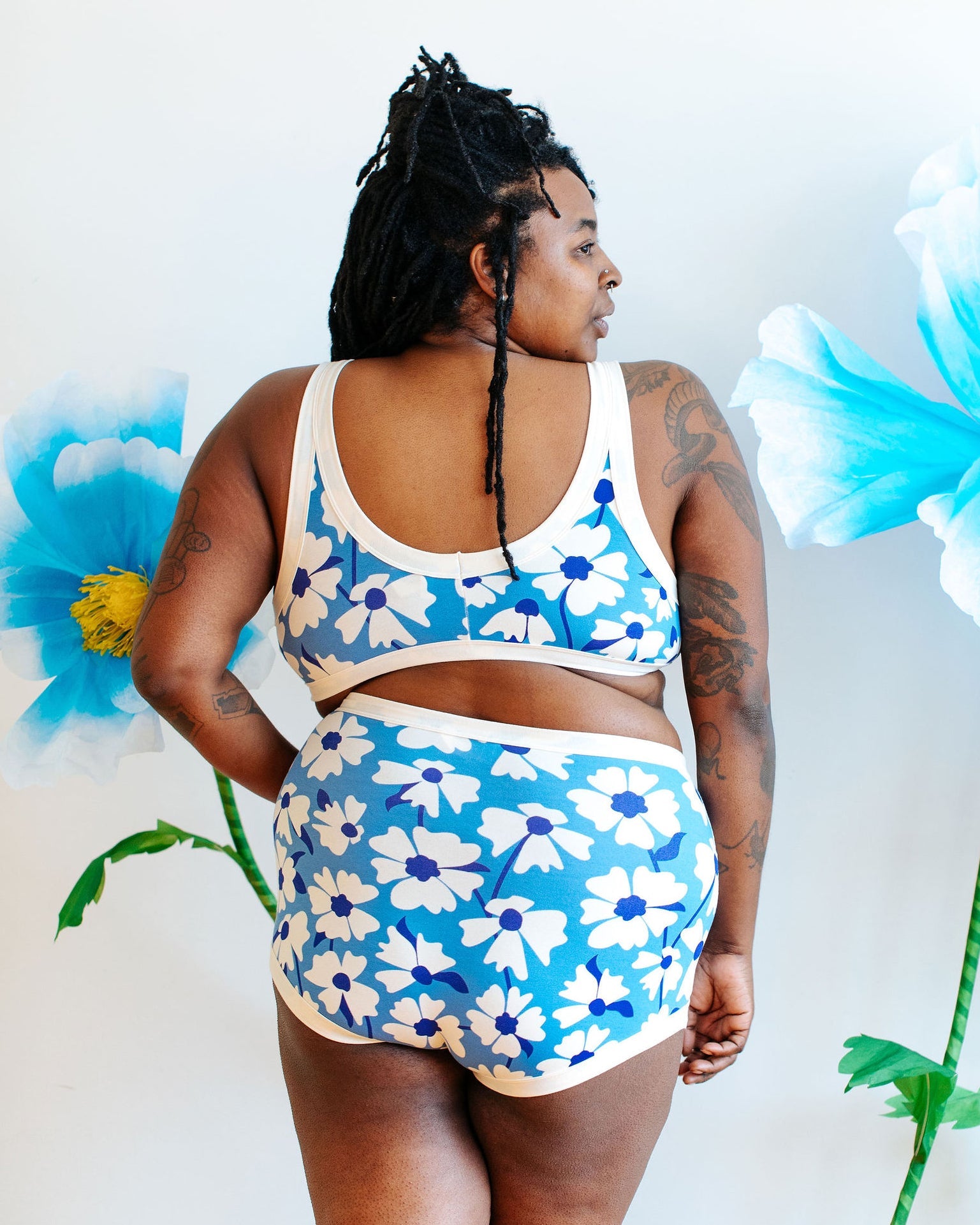 Model wearing Thunderpants USA Moody Blooms Bralette, styled for cozy season layering