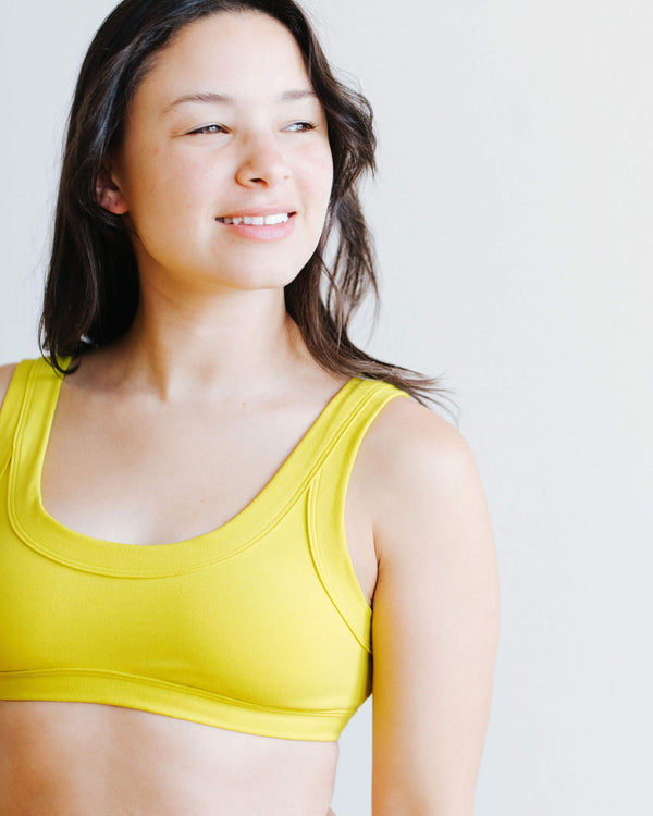 Side view of Thunderpants Star Fruit Bralette worn by model
