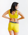 Back view of Thunderpants Star Fruit Bralette in bold yellow-chartreuse colour