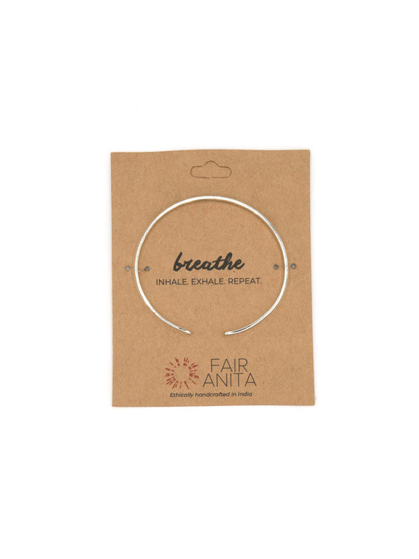 Silver-plated Breathe Cuff adjustable bangle bracelet by Fair Anita on white background