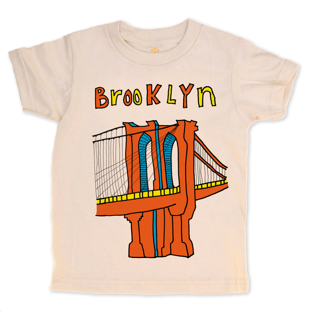 Beige t-shirt with a colorful illustration of the Brooklyn Bridge and 'Brooklyn' text on a white background