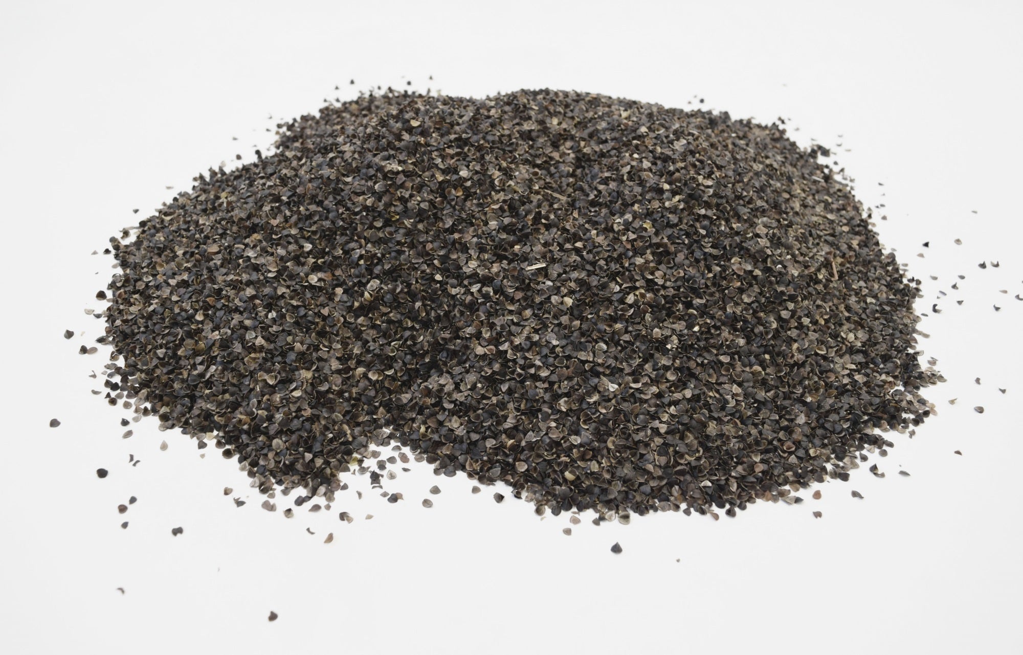 Pile of black pepper on a white background