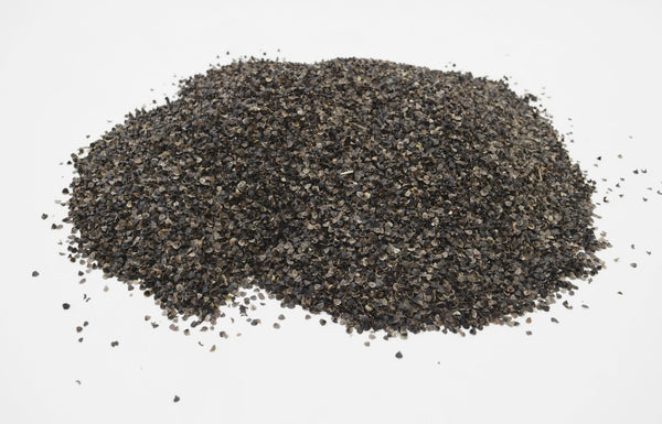 Pile of black pepper on a white background
