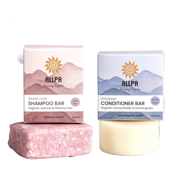 Two Allpa shampoo and conditioner bars with packaging on a light background