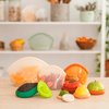 Food Huggers Eco Essentials Bundle in use keeping cut fruit and vegetables fresh without plastic wrap