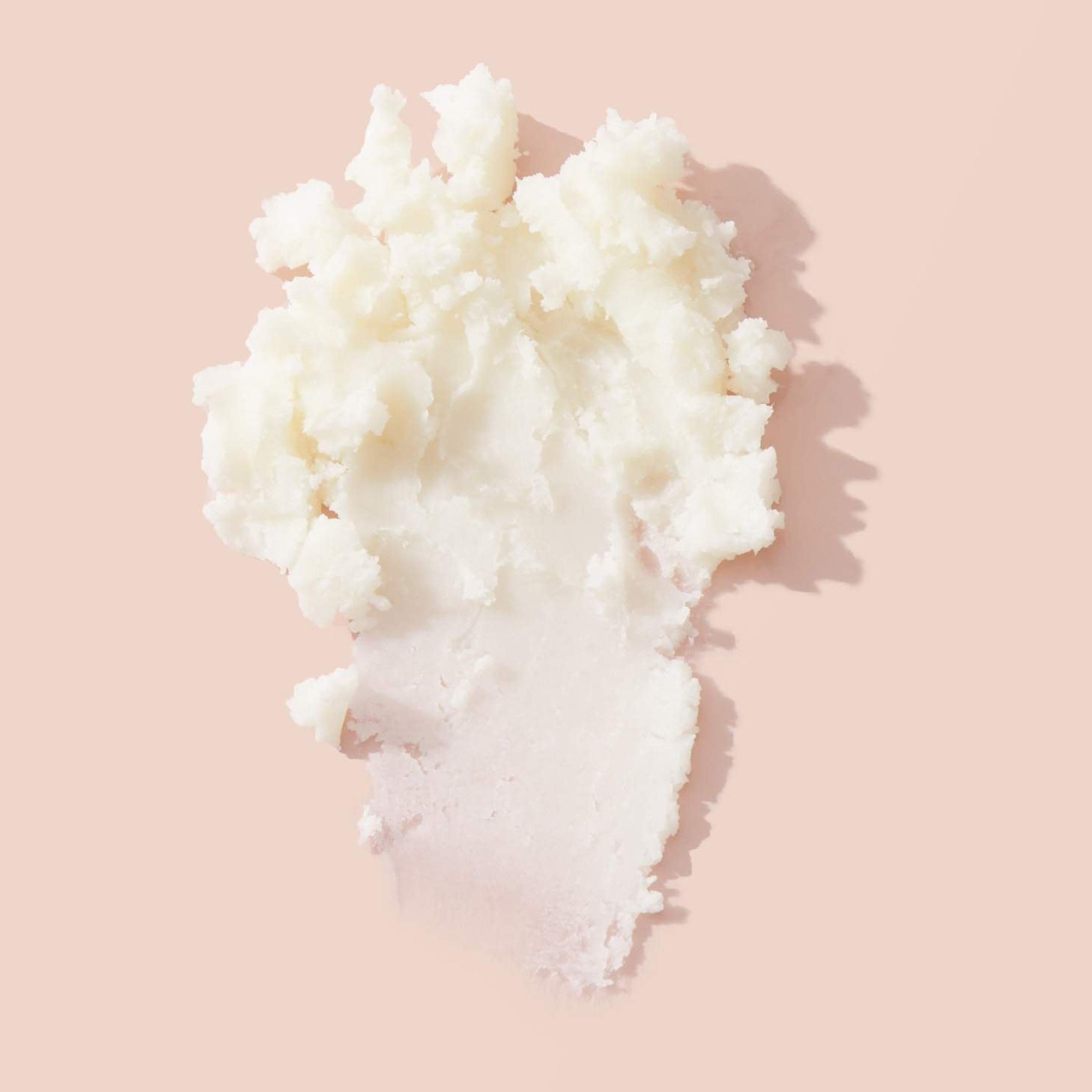 Block of mango butter, a natural emollient used in body butter and skin care formulas