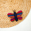 Butterfly cat toy by Upavim Crafts shown on a mat