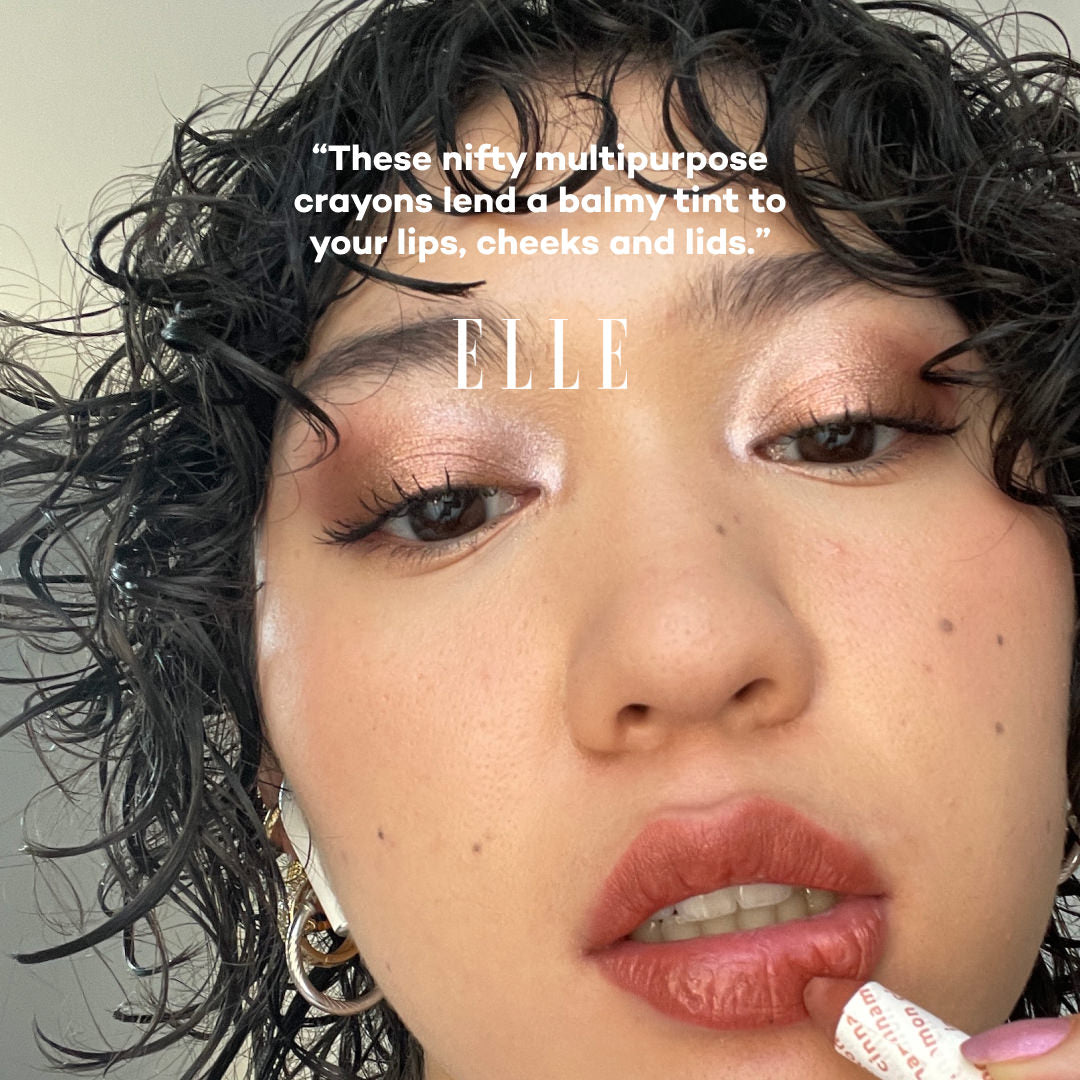 Close-up of a person with makeup, featuring text and the 'ELLE' brand name.
