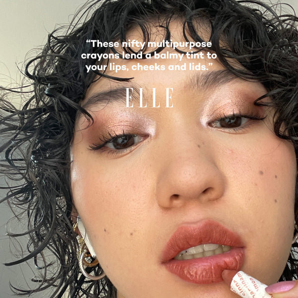 Close-up of a person with makeup, featuring text and the 'ELLE' brand name.
