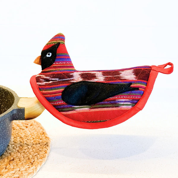 Colorful bird-shaped potholder on a white background