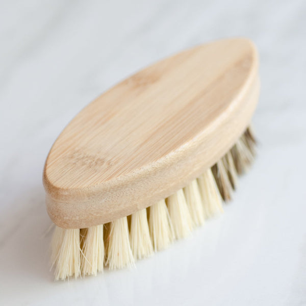 Wooden brush with bristles on a white background