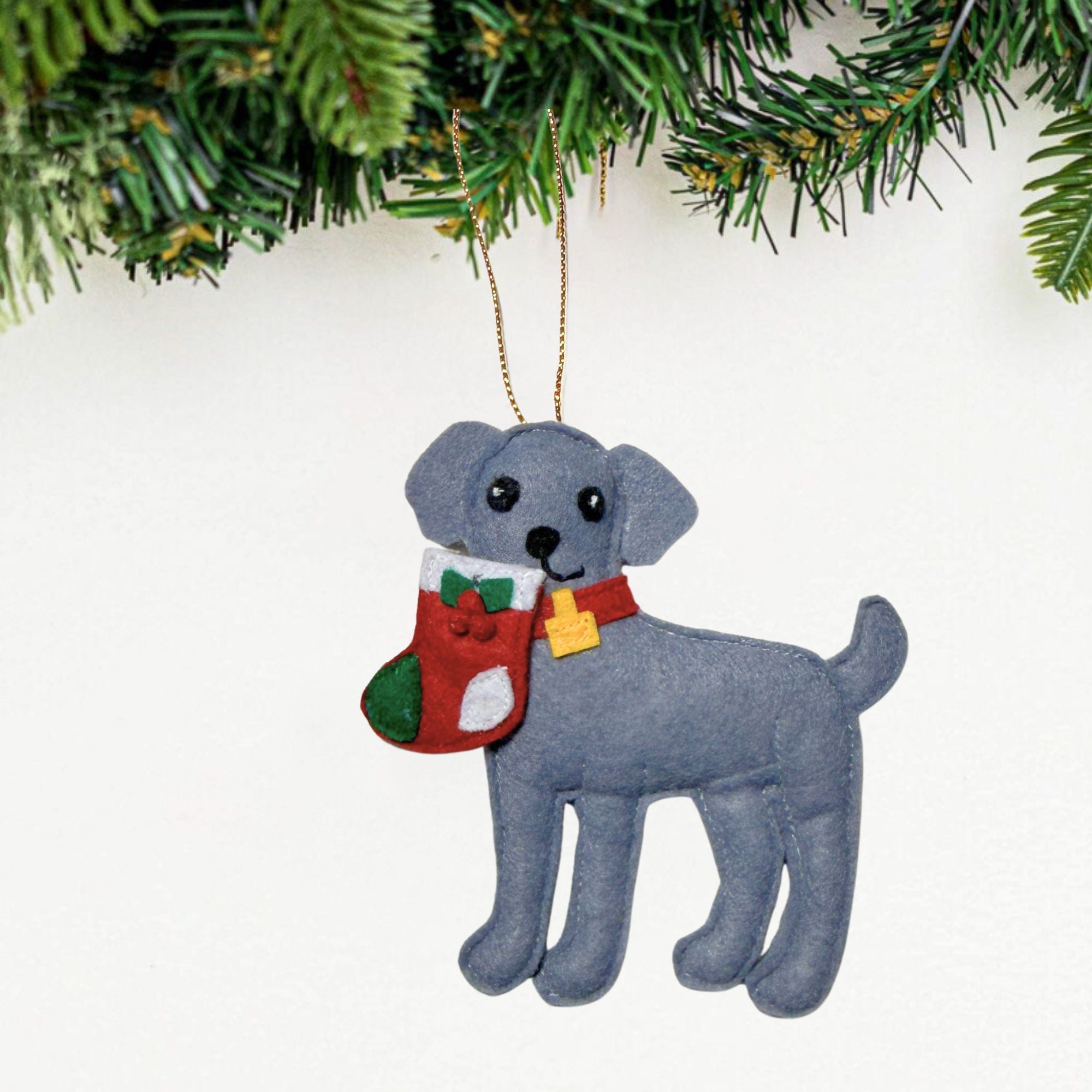 Caught with the Stocking Weimaraner Ornament, a handmade felt gray puppy carrying a Christmas stocking