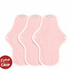 Three hannah organic reusable medium cloth pads made from certified organic cotton, laid flat on a clean surface