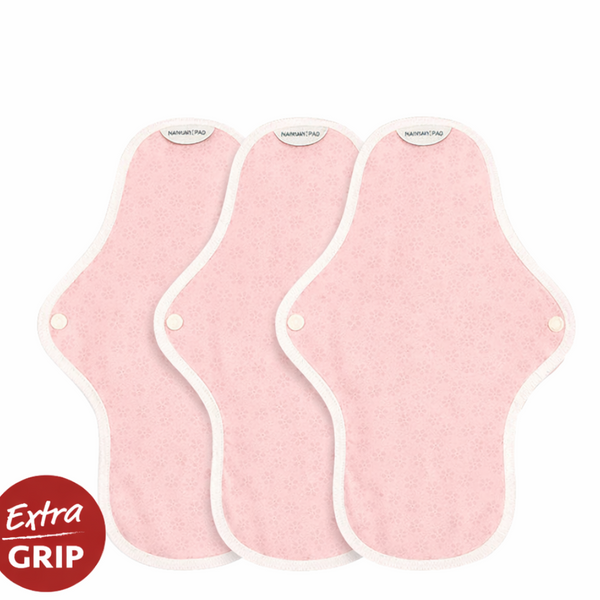 Three hannah organic reusable medium cloth pads made from certified organic cotton, laid flat on a clean surface