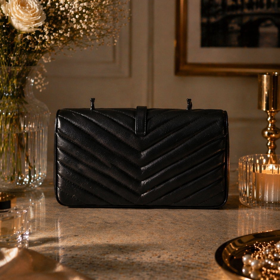 Onali Pure Gold Black Revel luxury handbag — black and gold evening bag close-up detail
