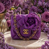 Close-up of purple luxury candle with delicate real flower detail, hand-poured by Onali Pure