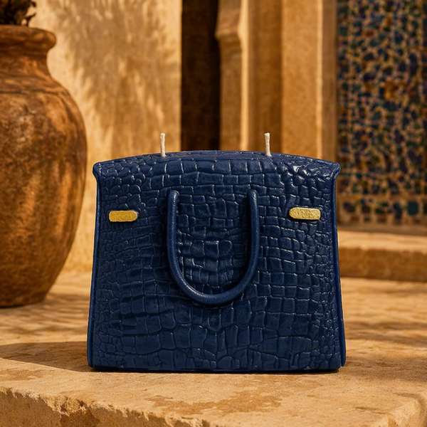 The Bleue Iconic blue handbag candle displayed as a decorative home accent piece by Onali Pure