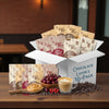 Box of Dooy Gats chocolate lover's 30-pack with coffee and snacks on a table.
