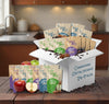 Assorted packages of Dolly Oats cereal in a box on a kitchen counter.