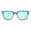 Sunglasses with colorful frame and blue lenses on a white background