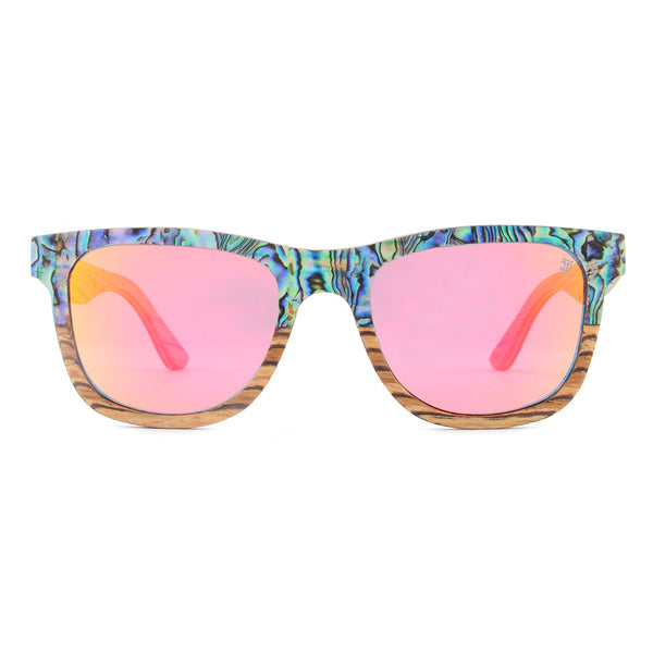 Sunglasses with colorful frame and pink lenses on a white background