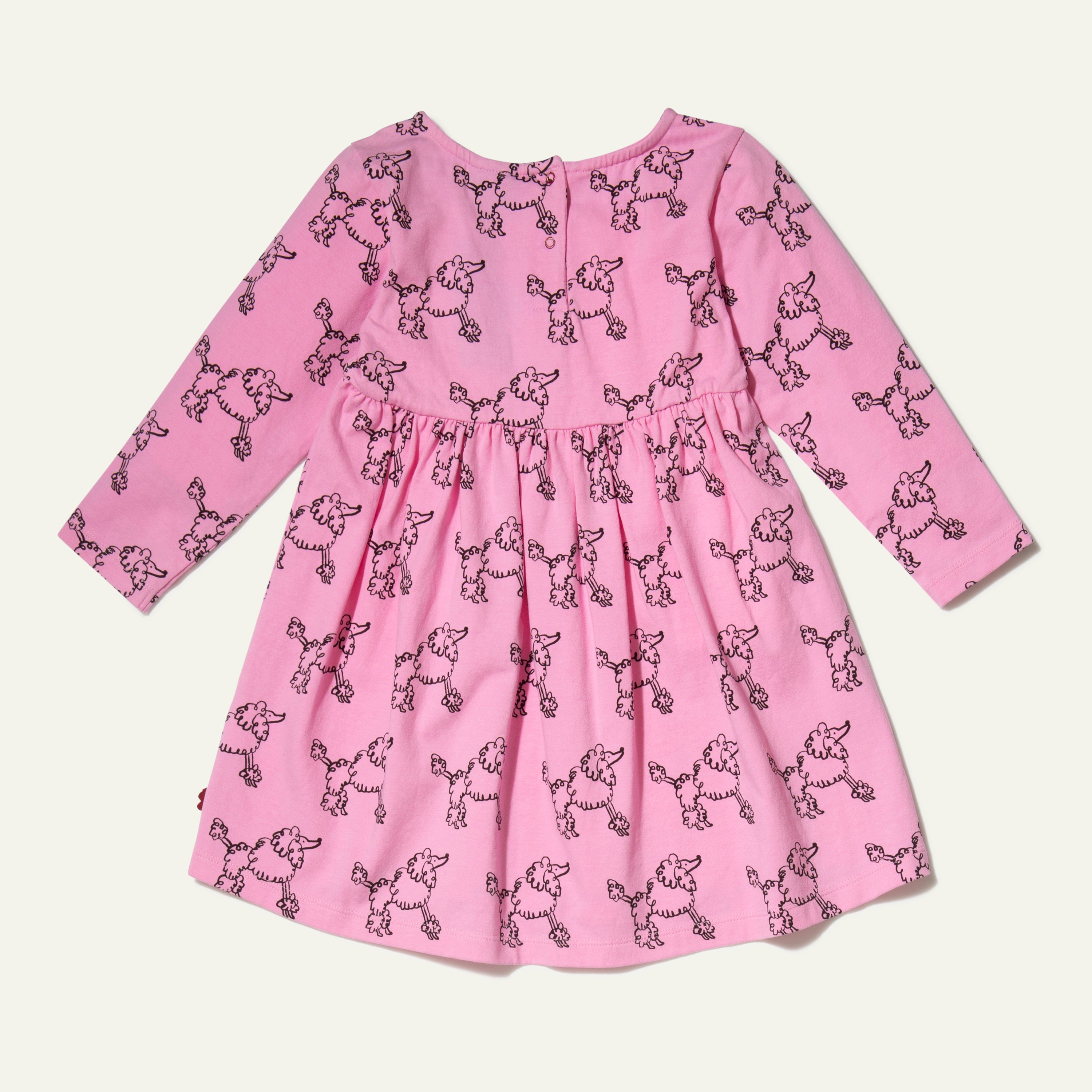 Mon Coeur Coco Baby Dress back view — showing snap button closure on sustainable poodle print baby dress made in Portugal