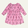 Mon Coeur Coco Baby Dress back view — showing snap button closure on sustainable poodle print baby dress made in Portugal