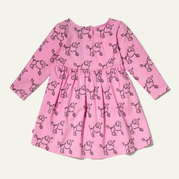 Mon Coeur Coco Baby Dress back view — showing snap button closure on sustainable poodle print baby dress made in Portugal