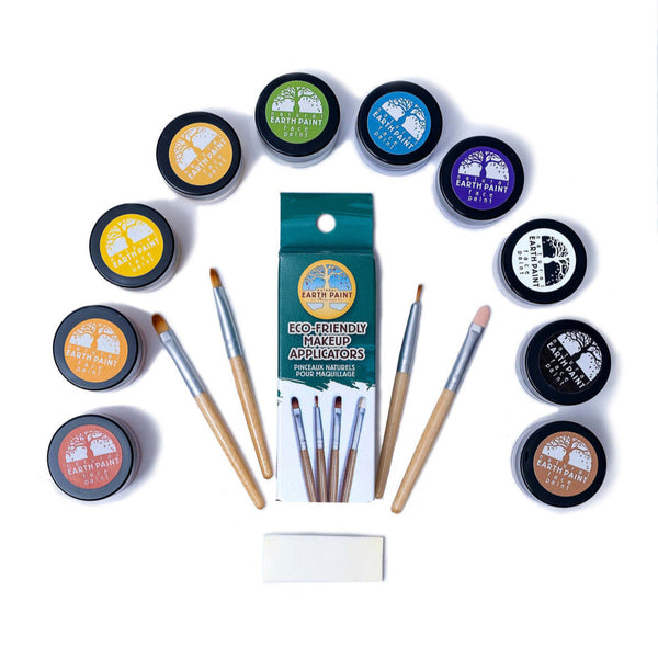 Earth Paint makeup set with containers, brushes, and applicators on a white background
