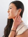 Fair Anita black ceramic bracelet shown on wrist, adjustable sliding closure