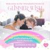 Woman and child in a bubble bath with 'Glimmer Wish' branding and product description text.