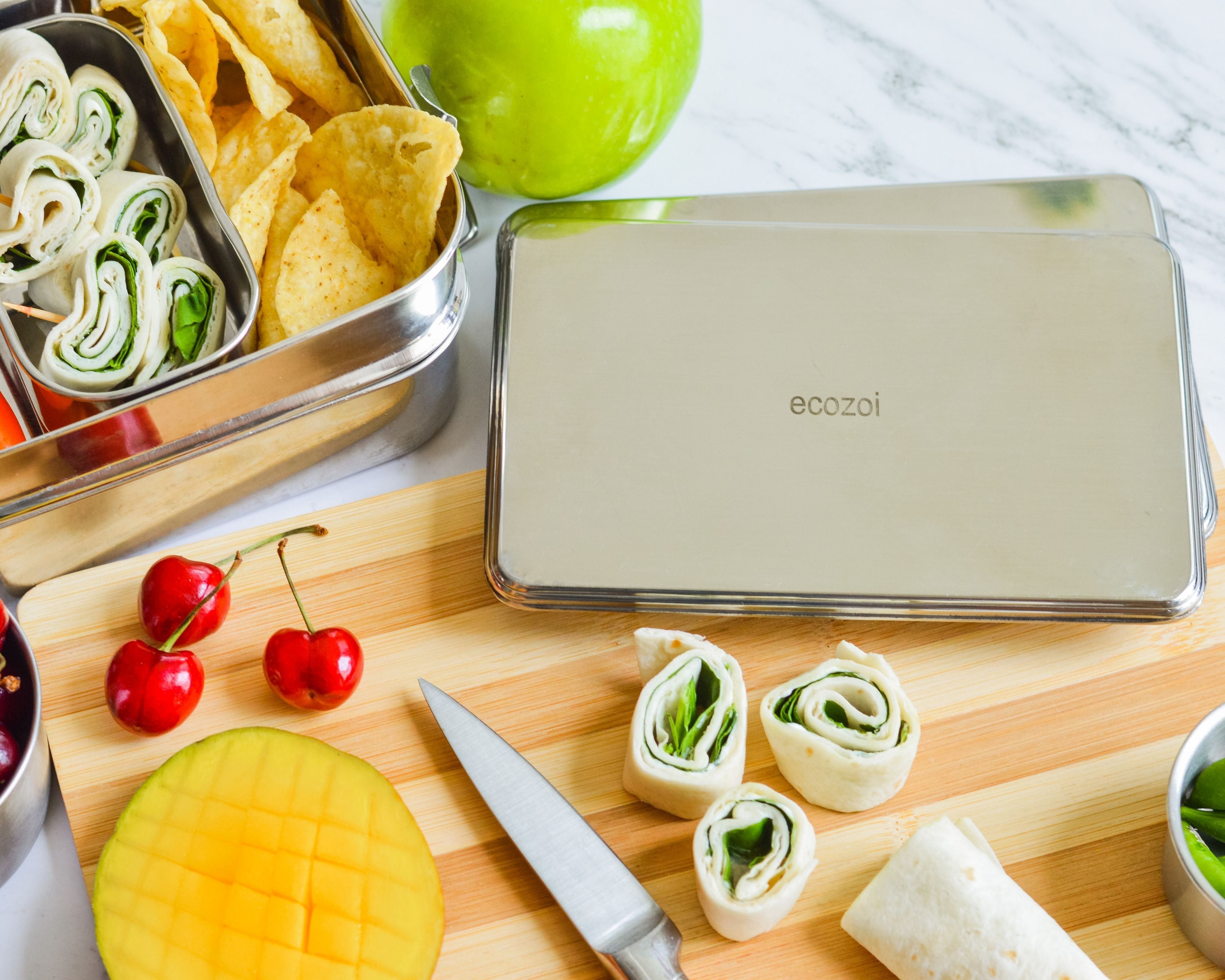 Ecozoi stainless steel ice packs placed inside a kids lunch box to keep food cold