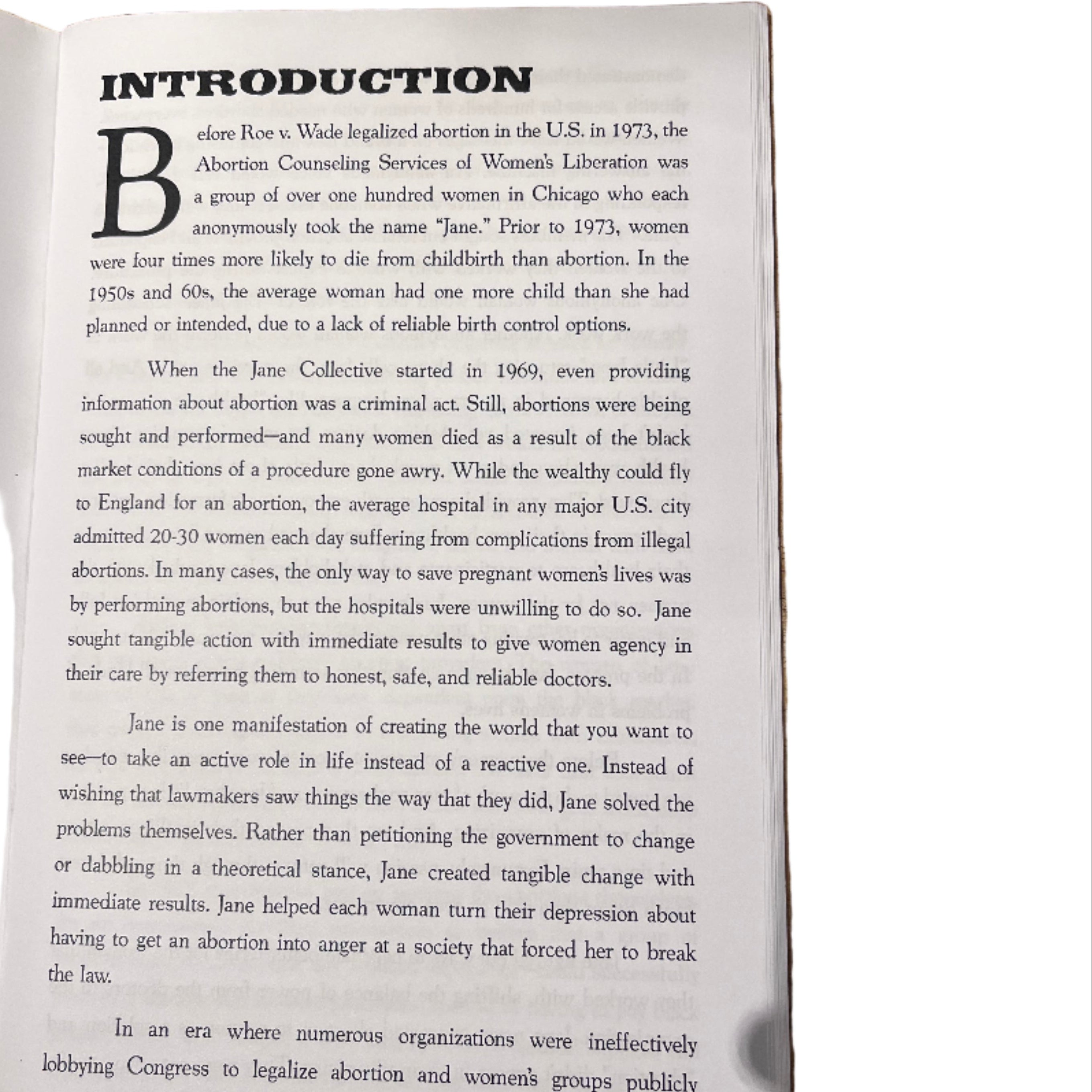 Open book on a wooden surface with visible text