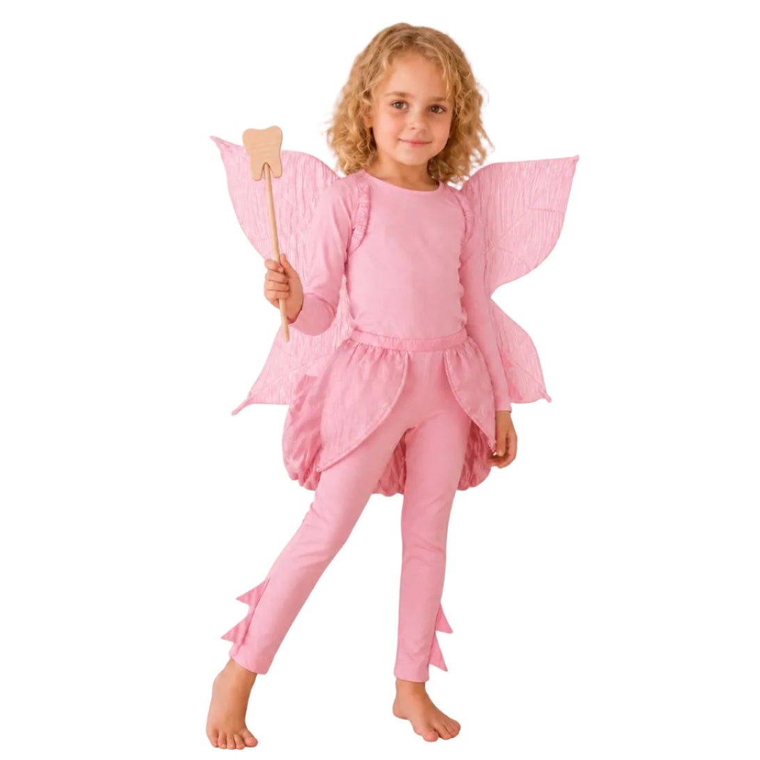 Child wearing the Pink Tooth Fairy Costume with cotton top, petal skirt, and fairy wings