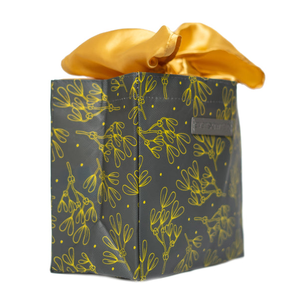 Close-up of grey and gold floral print EverBag with built-in gold satin ribbon bow