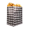 Close-up of EverBag buffalo check gift bag with tied gold satin ribbon