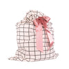 EverWrap large tie bag with satin ribbon bow tied at the top, black grid design