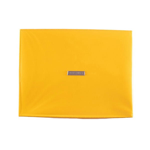 Close-up of white grosgrain ribbon tied in a bow on EverBox yellow gift box