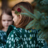 Detail shot of ruffle trim on Mon Coeur recycled cotton fleece dress for girls