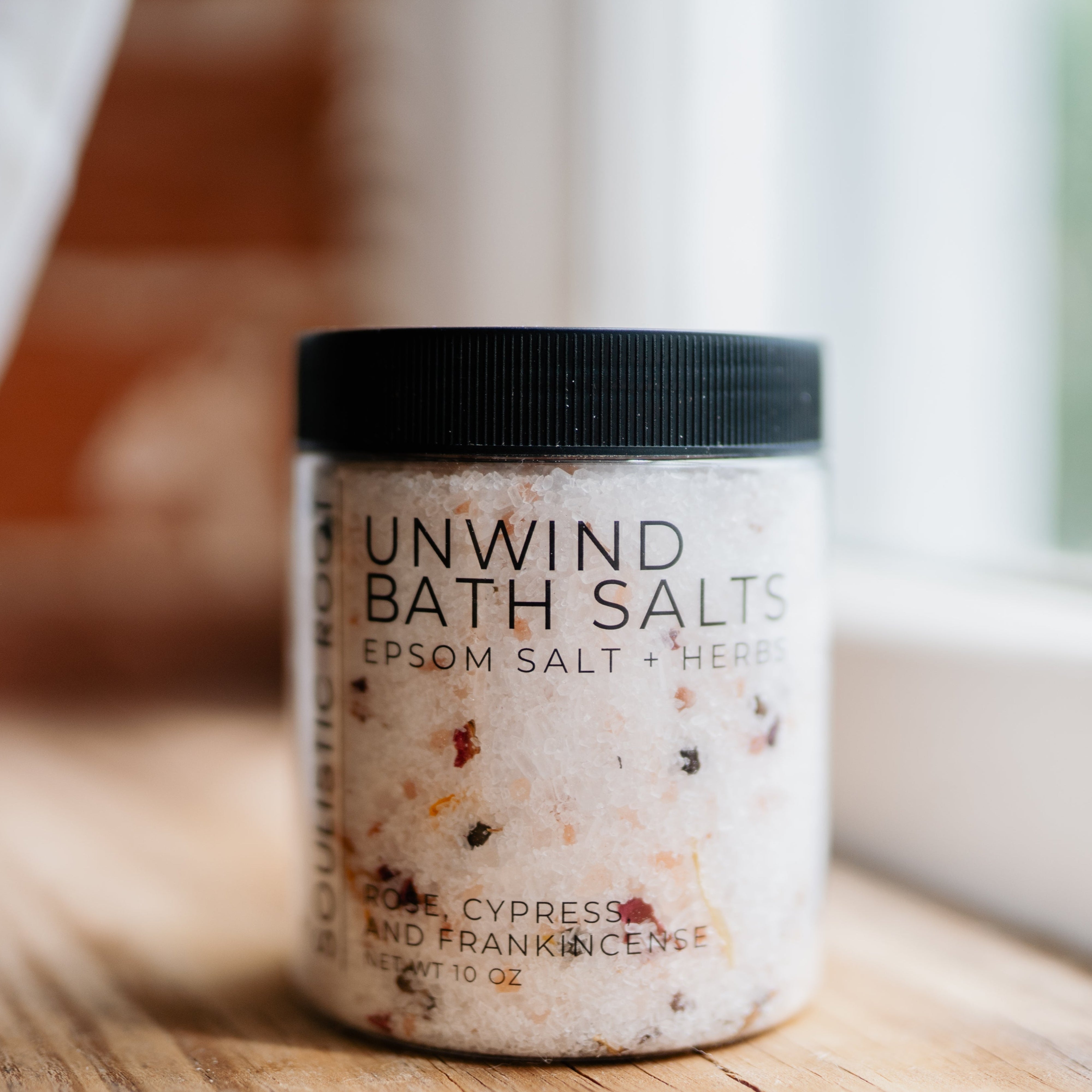 Soulistic Root Unwind Herbal Bath Soak jar with dried botanicals and Epsom salt