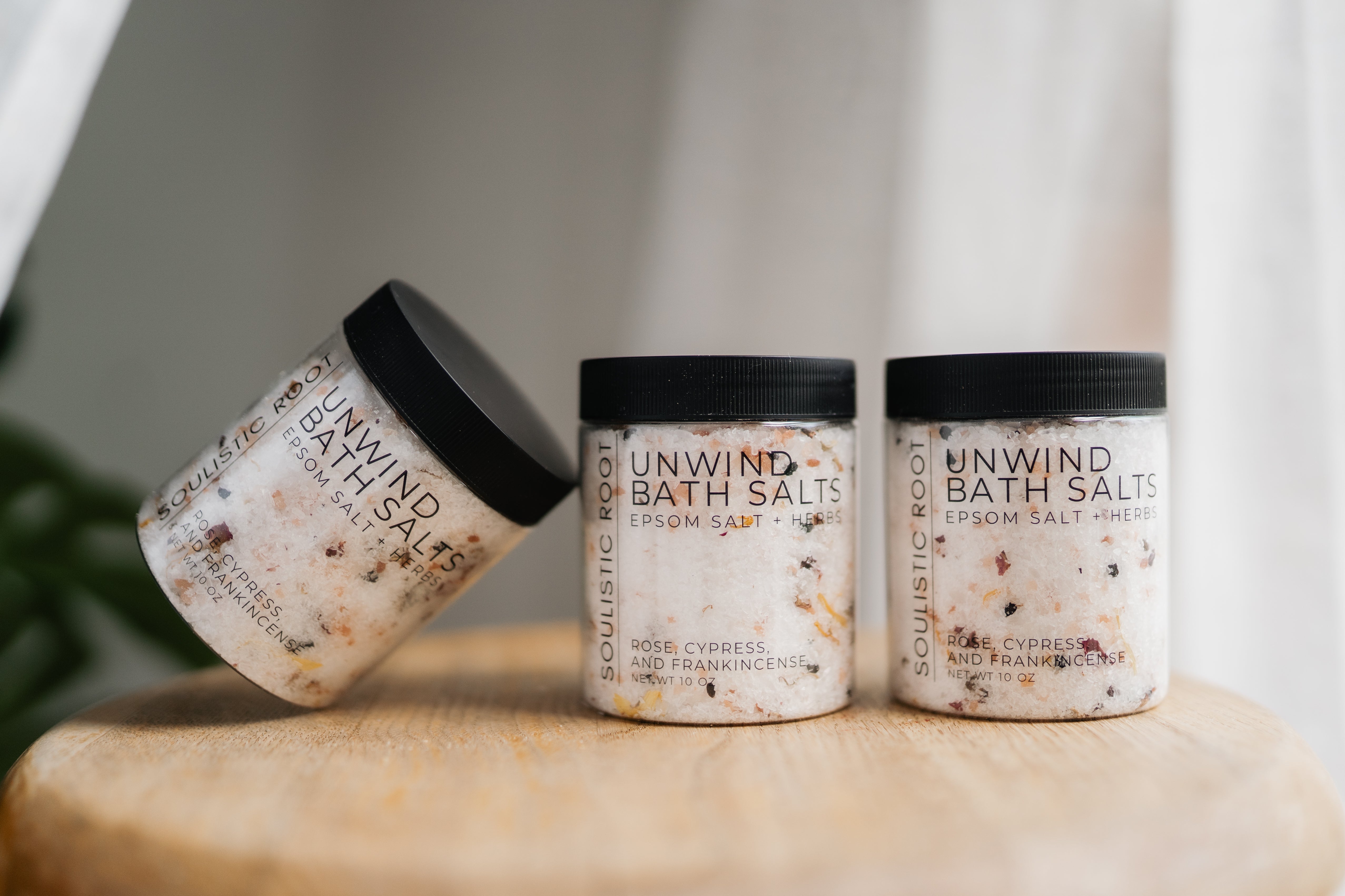 Soulistic Root Unwind Bath Salt displayed with natural botanical ingredients