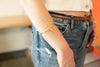 Model wearing silver viper snake cuff bracelet on wrist, styled as everyday jewellery